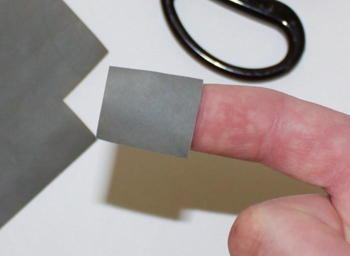 For isolated scratches, you can cut the sandpaper into small pieces.